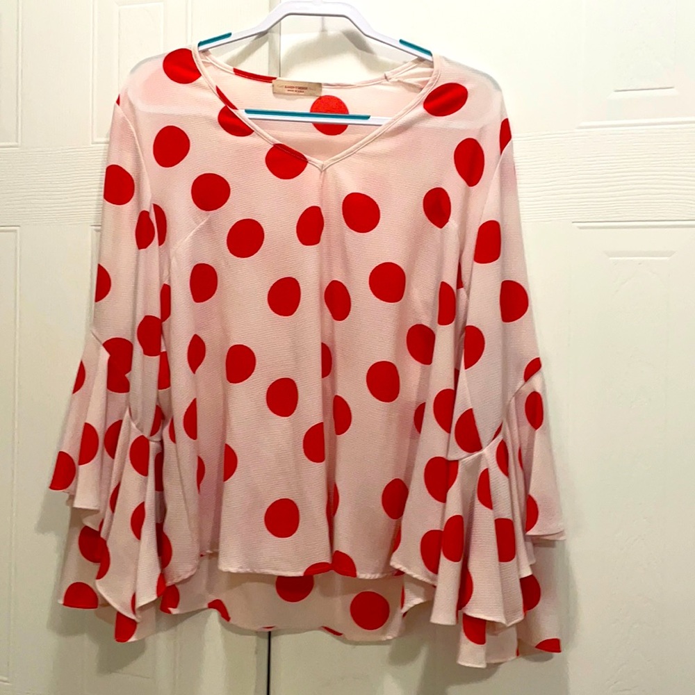 Polka Dot Blouse with ruffled bell sleeves.